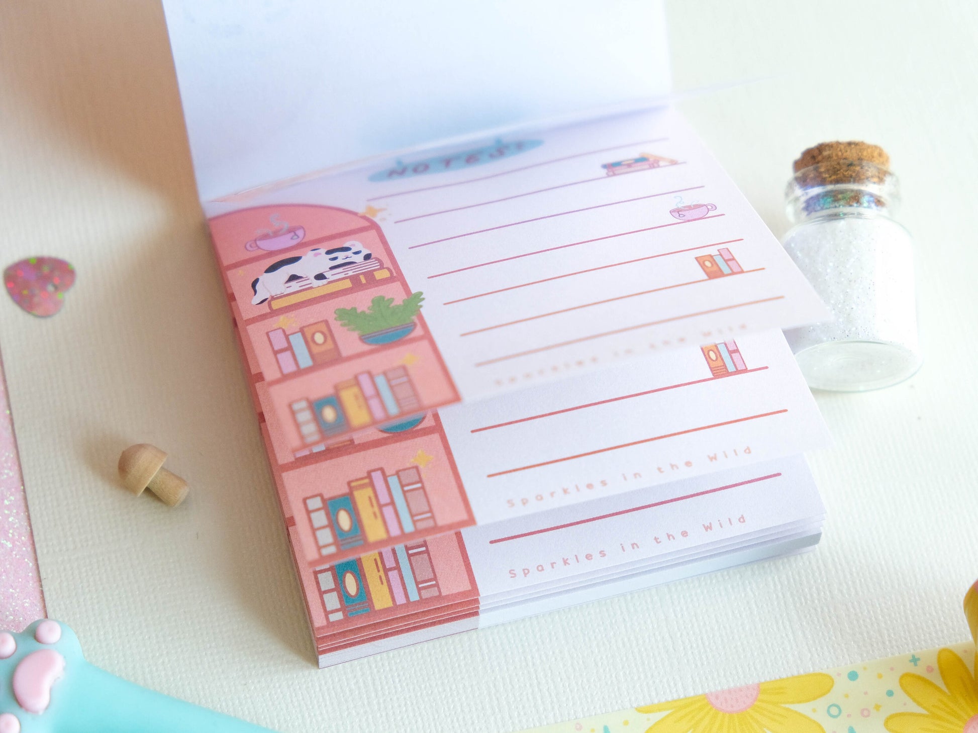 Square notepad with detachable sheets for book lovers, featuring a library and a cozy sleeping cat ambiance with 50 sheets for note-taking